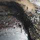 Cleaning crews working to remove oil from a beach off the summer resort town of Ancon, northern Lima, on January 22, 2022.